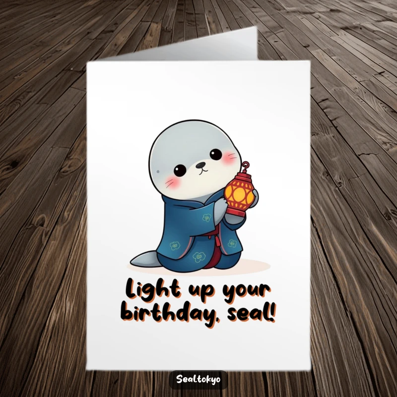 Free Printable Birthday Card: Elegant Seal in Blue Kimono Holding Lit Lantern - Serene Wish
