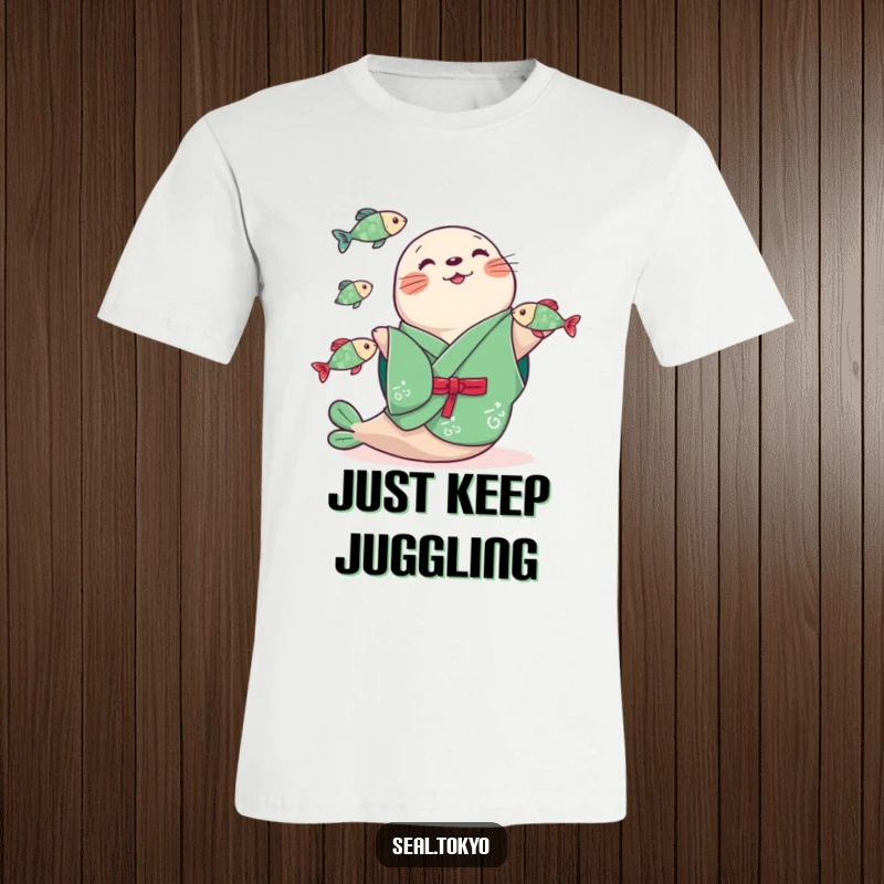 Funny seal wearing a green kimono, enthusiastically juggling three tiny fish, printed on a comfortable t-shirt. A delightful visual gag.